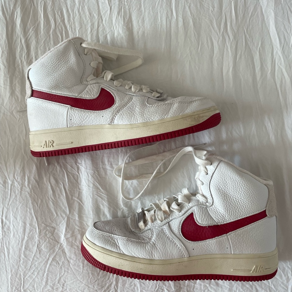 Nike high top sneakers with red detailing..Worn once.